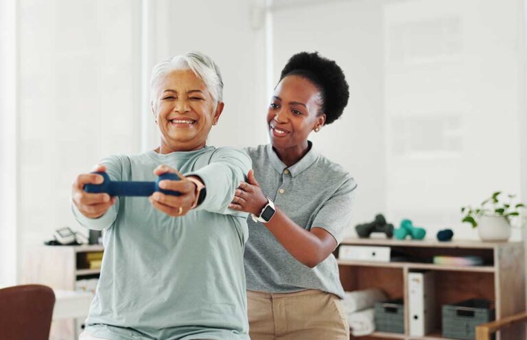 Physical therapist guiding an adult through a balance exercise beside a treatment table.
